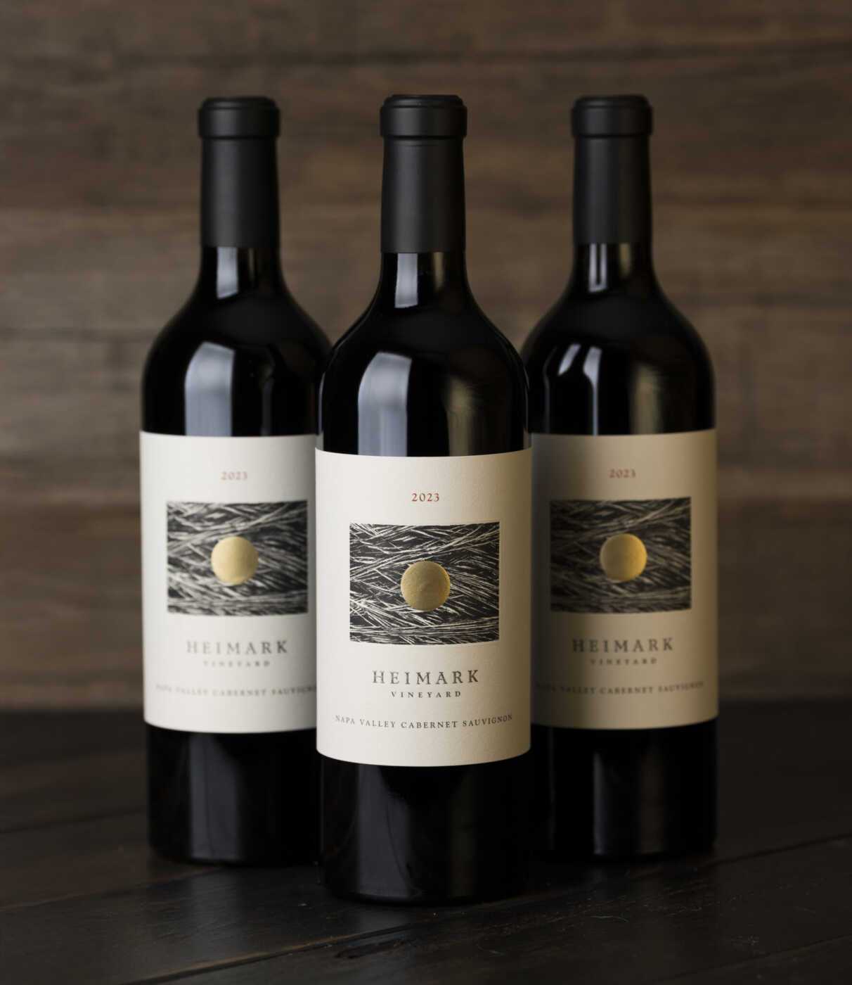Three bottles of the 2023 Heimark Vineyard Cabernet Sauvignon.